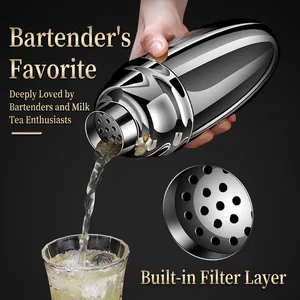 Professional stainless steel cocktail shaker pouring drink with built-in filter and mirror finish