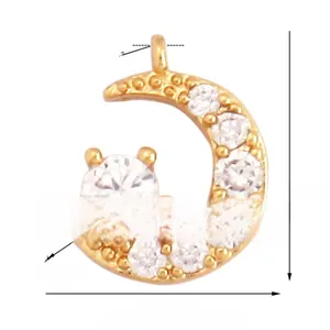 Detail of moon-shaped pendant in gold-plated copper with sparkling cubic zirconia