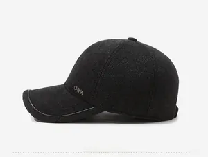 Detail view of charcoal wool blend baseball cap featuring a metal CHINA logo on the side