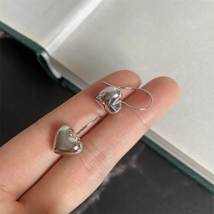 Minimalist S925 sterling silver 3D heart-shaped drop earrings with a high-polished silver finish