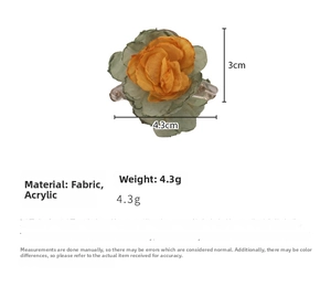 Detail view of yellow and green fabric flower hair claw with acrylic base and dimensions
