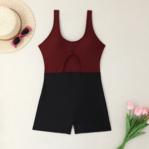 Detail of burgundy and black colorblock one-piece swimsuit with cutout and boy shorts