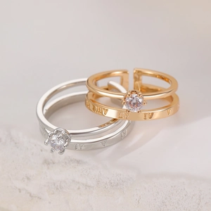 Detail of adjustable crown rings with roman numerals and round brilliant zircon stones