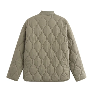 Back view of wave quilted jacket in sage green featuring subtle fabric texture