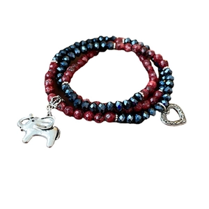 Three-layer beaded bracelet with red and dark blue beads plus elephant charm