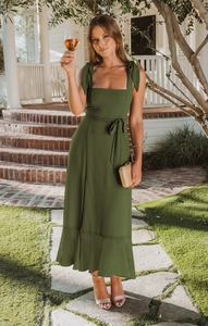 Detail of square neckline with elegant shoulder bow ties on olive green midi dress