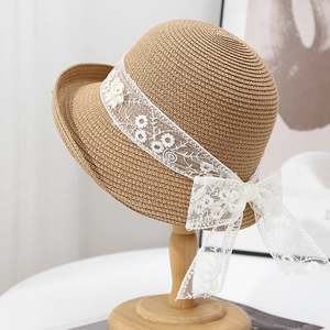 French straw sun hat with floral lace ribbon and bow for summer beach photography