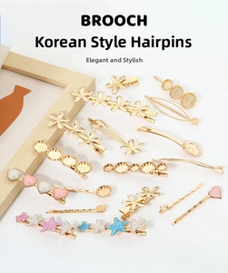 Detail of Korean style hair clips with gold finish and colorful enamel heart flower shapes