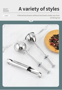 Three-piece stainless steel tea infuser set including ball and pipe shapes on marble