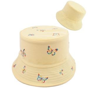 Detailed close-up of colorful butterfly embroidery on a yellow cotton bucket hat