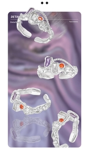 Macro detail of S925 sterling silver ring with colorful zircon stones and twisted texture