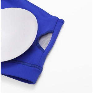 Detail of royal blue yoga bra showing inner mesh lining and removable white circular chest pad
