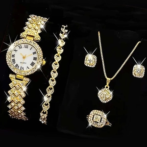 Detailed top view of gold-plated Roman numeral watch and rhinestone jewelry set