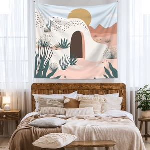 Bohemian desert tapestry hanging above a wooden headboard in a cozy bedroom scene