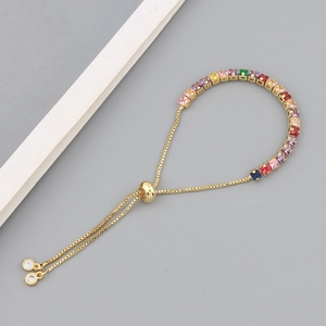 Adjustable gold chain bracelet featuring a row of vibrant colorful square cubic zirconia