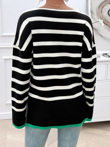 Detail of black and white striped knit sweater with green trim back view for women