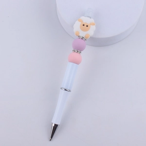 Detail of DIY beaded pen featuring a cute sheep silicone bead with rhinestone spacers