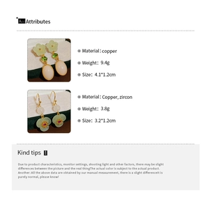 Detailed view of resin flower earrings with zircons and product dimensions on green velvet