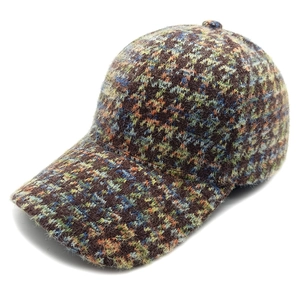 Classic houndstooth baseball cap in colorful tweed knit texture with warm winter design