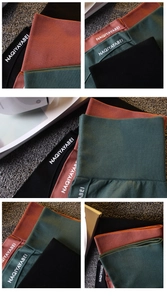 Détail du short de yoga côtelé à taille haute en noir, rouge et vert avec logo à la taille