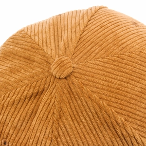 Detailed top view of a classic camel corduroy baseball cap with a textured button