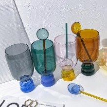 Colorful contrast glass goblets with matching glass spoons for juice or milk