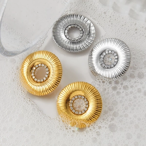 Gold and silver hollow circular sunburst earrings with sparkling zircon crystals