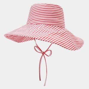 Detail of red and white striped wide-brim sun hat with adjustable chin strap ties