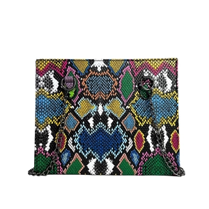 Chic multi-color snakeskin pattern crossbody bag with a black metal chain strap