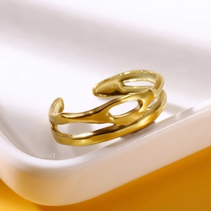 Macro shot of gold-plated stainless steel hollow irregular geometric ring details