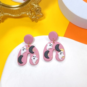 Detail of pink polymer clay Halloween earrings with ghosts, moon and gold foil motifs