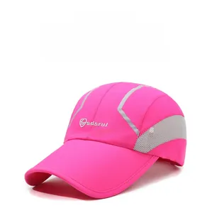 Detail of pink sport baseball cap featuring breathable grey mesh side and reflective strip