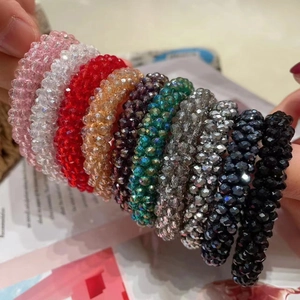 Set of 10 colorful crystal beaded hair ties and bracelets in various shimmering shades