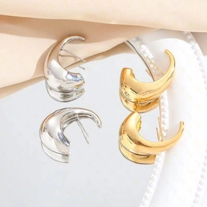 Elegant thick crescent moon stud earrings in polished gold and silver finishes