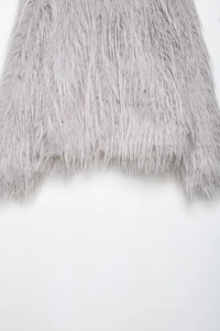 Detailed close-up showing the soft texture of the grey faux fur coat fabric