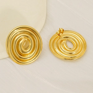 Boucles d'oreilles vintage françaises en forme de disque spirale doré en acier titane