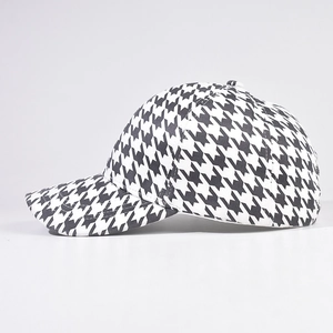 Classic black and white houndstooth baseball cap with thick fabric and structured crown