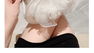 Close-up of white floral evening clutch bag with silk-like 3D petal and pleated details