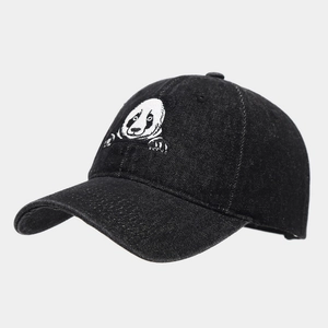 Close-up of high-quality embroidery featuring a cute giant panda on a black denim baseball cap