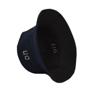 Detailed close-up of 'on' and 'off' letter embroidery on a cotton bucket hat