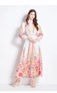 Close-up of floral print dress with mandarin collar and matching belted waist detail