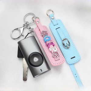 Detail of pink and blue PU leather wristlets with crystal LOVE charms and metal lobster clasps