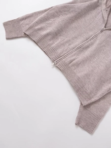 Close-up of knit texture and silver zipper on the mauve wool hooded cardigan for women