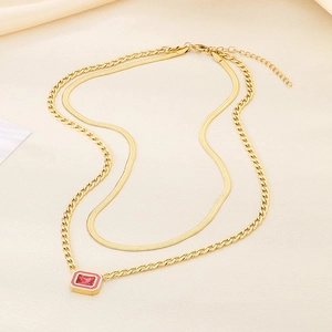 Elegant double-layered gold snake chain necklace with a pink gemstone square pendant