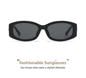 Close-up of classic black rectangular sunglasses with dark grey lenses and a glossy finish