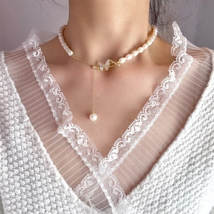 Freshwater pearl necklace with gold zircon butterfly pendant and long fringe tassel