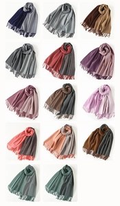 Detailed grid view showcasing multiple two-tone faux rabbit fur scarves with fringe ends