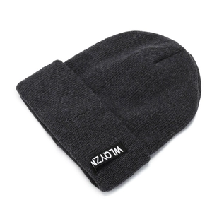 Dark grey knitted beanie with ribbed texture and minimalist woven logo label for men and women