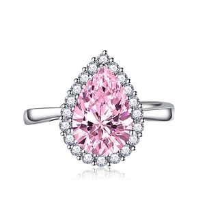 Luxurious pear-cut pink gemstone halo ring in silver with a polished finish