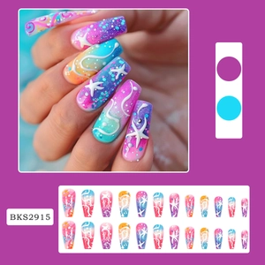 Macro detail of long coffin press-on nails with colorful gradient and starfish pattern